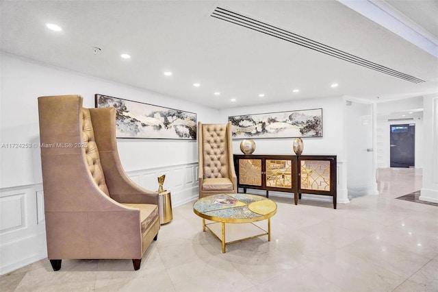 sitting room with crown molding