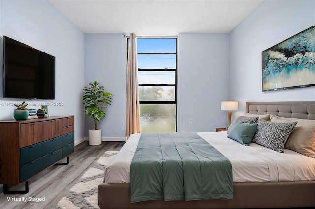 bedroom featuring light wood-type flooring