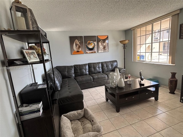 tiled living room featuring a textured ceiling