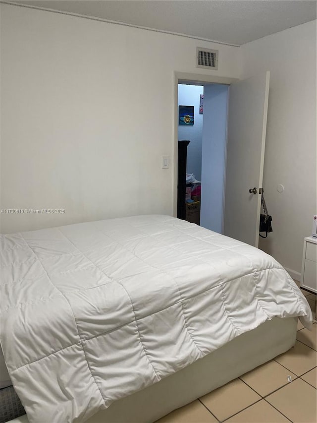 bedroom with tile patterned flooring