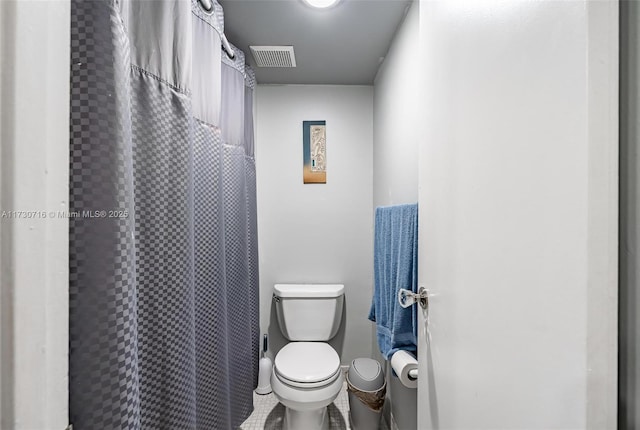 bathroom featuring toilet