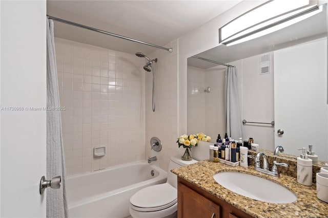 full bathroom featuring shower / tub combo with curtain, vanity, and toilet