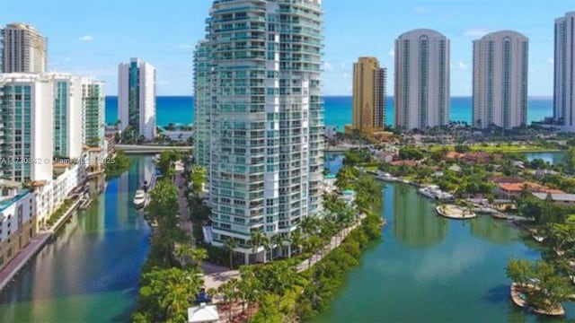 drone / aerial view with a view of city and a water view