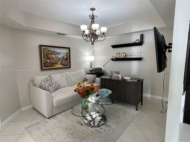 living room featuring light tile patterned floors, visible vents, baseboards, a tray ceiling, and a notable chandelier