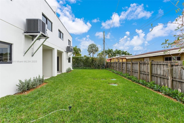 view of yard featuring central AC