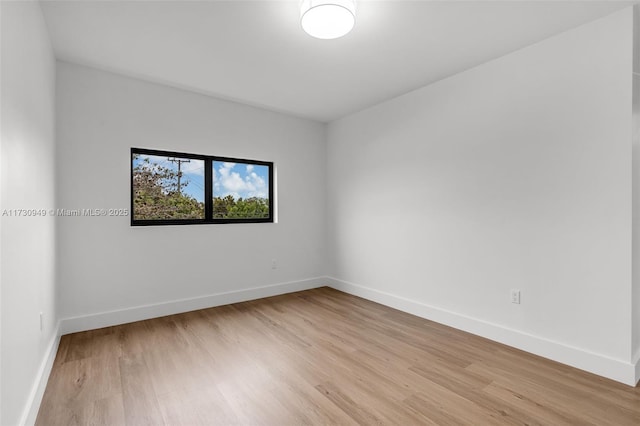 unfurnished room with light hardwood / wood-style flooring