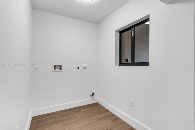 laundry room with wood-type flooring, electric dryer hookup, washer hookup, and gas dryer hookup