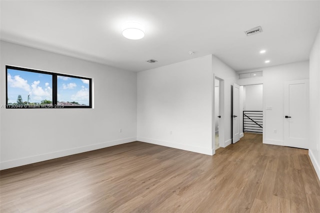 empty room with light wood-type flooring