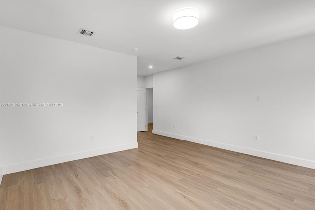 unfurnished room with light hardwood / wood-style floors