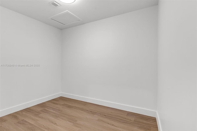 empty room with light hardwood / wood-style floors