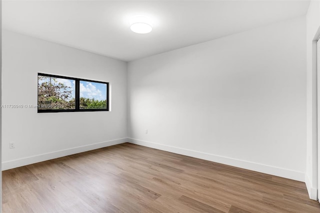 spare room featuring light hardwood / wood-style floors