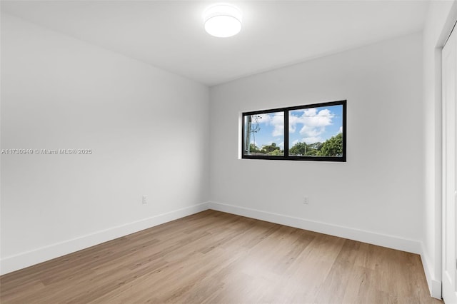 spare room featuring light hardwood / wood-style floors