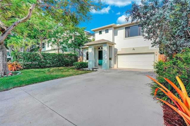 view of front of house featuring a garage and a front lawn