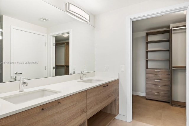 bathroom featuring vanity and tile patterned flooring