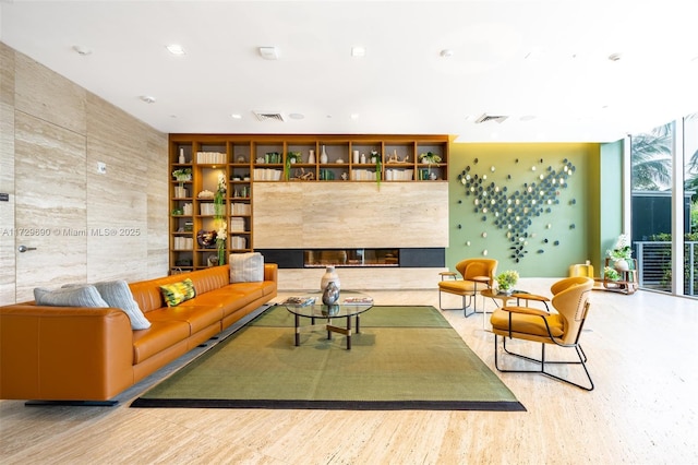 living room featuring a tiled fireplace