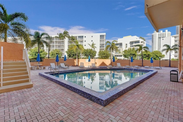 view of pool featuring a patio area