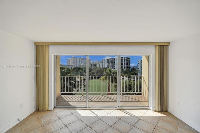 empty room with light tile patterned floors