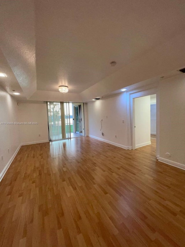 empty room featuring hardwood / wood-style floors and a textured ceiling