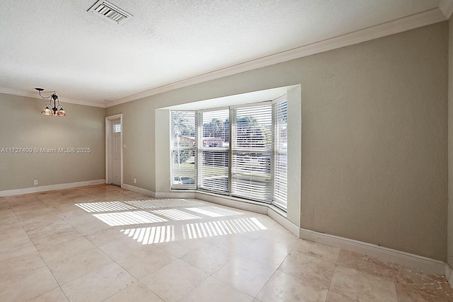 spare room featuring crown molding and a chandelier