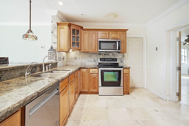 kitchen featuring tasteful backsplash, sink, decorative light fixtures, ornamental molding, and stainless steel appliances