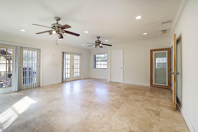 spare room featuring crown molding and french doors