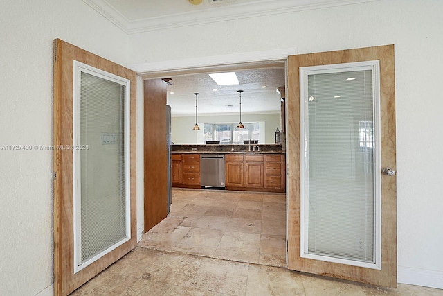 hallway featuring crown molding, sink, and a skylight