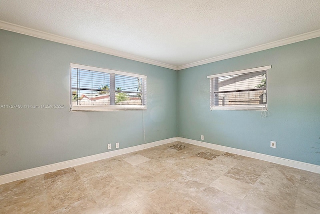 empty room featuring crown molding and a textured ceiling