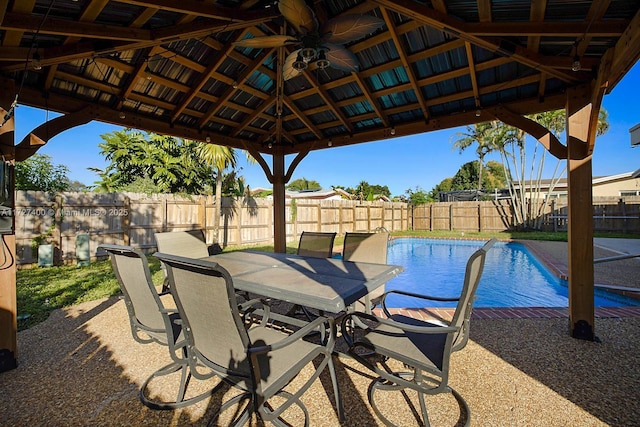 view of pool with a gazebo, ceiling fan, and a patio