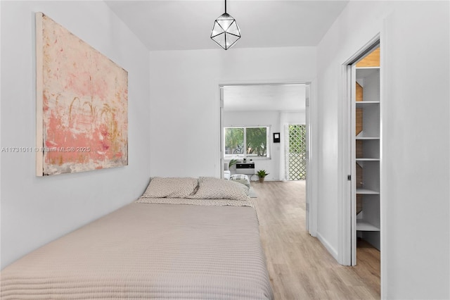 bedroom with light wood-type flooring