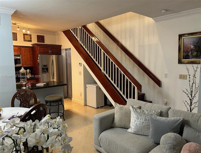 living room featuring crown molding