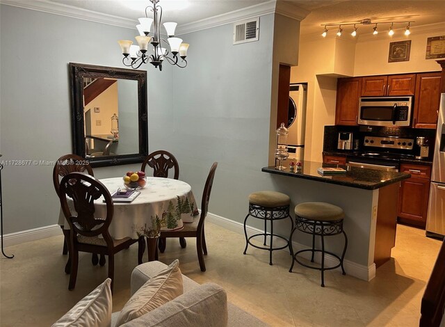 dining space featuring ornamental molding