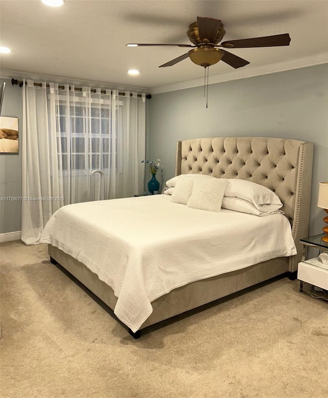 bedroom featuring carpet, ceiling fan, and ornamental molding