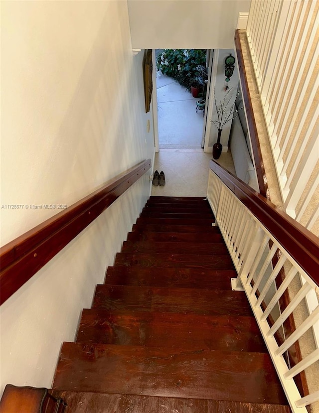 stairway featuring hardwood / wood-style flooring