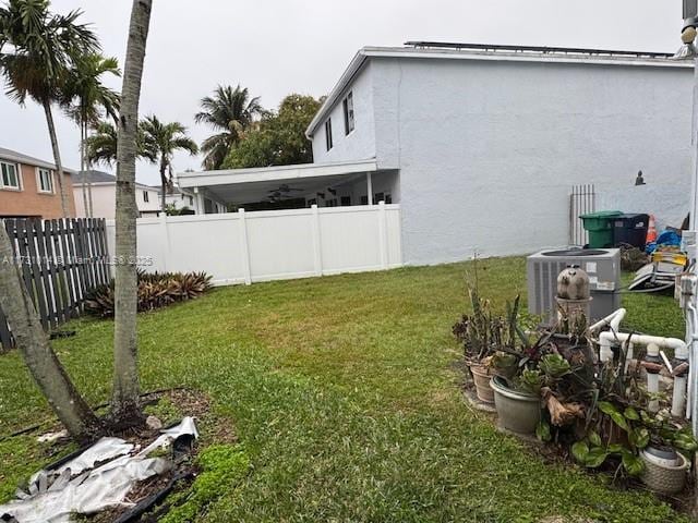 view of yard with central AC unit