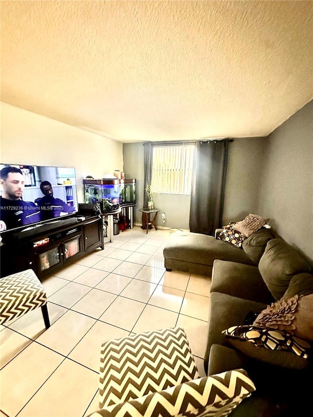 living room featuring light tile patterned floors and a textured ceiling