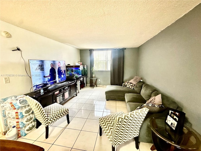 living room with light tile patterned flooring and a textured ceiling