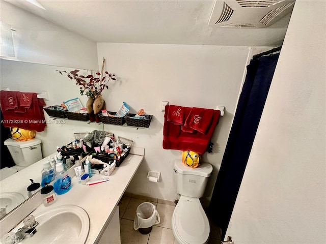 bathroom with vanity, toilet, tile patterned floors, and a shower with shower curtain