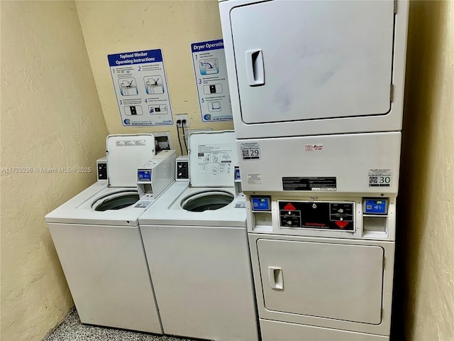 laundry area with stacked washing maching and dryer and independent washer and dryer