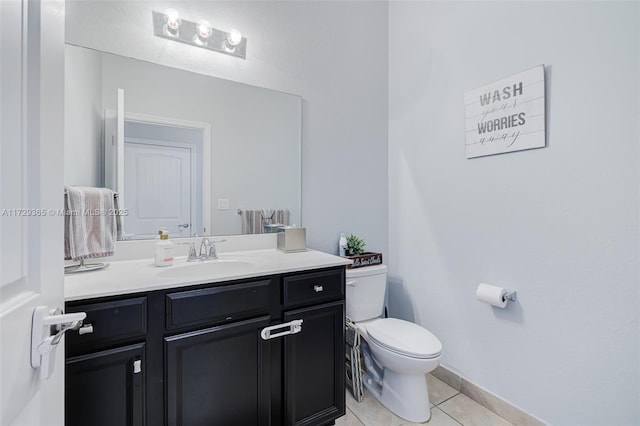 bathroom featuring toilet, tile patterned floors, and vanity