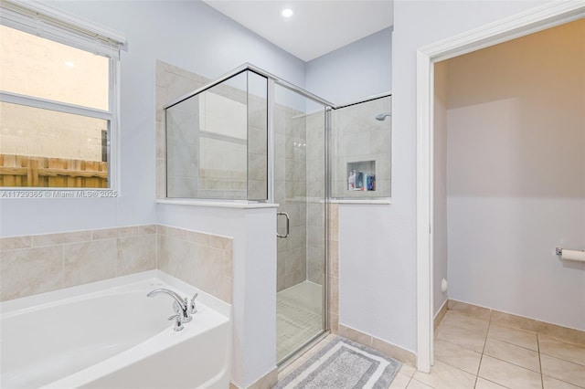 bathroom with plus walk in shower and tile patterned flooring