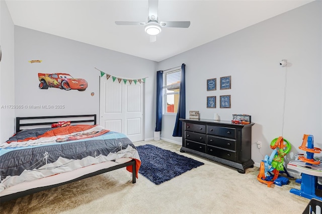 bedroom featuring ceiling fan, carpet, and a closet