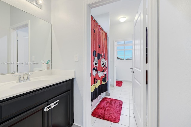 bathroom with vanity and tile patterned flooring