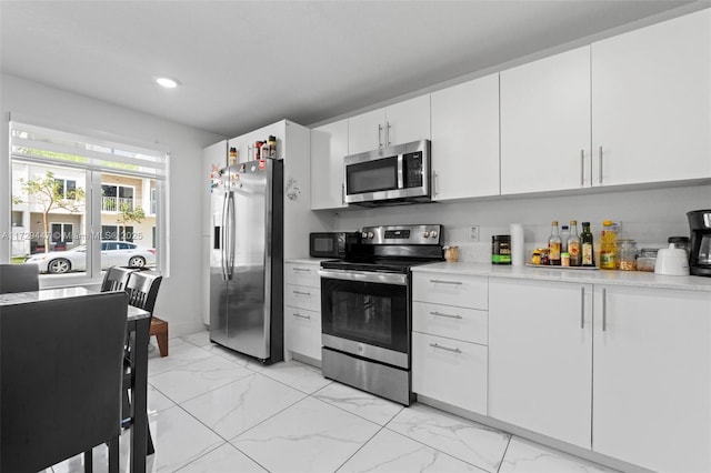 kitchen with white cabinets and stainless steel appliances