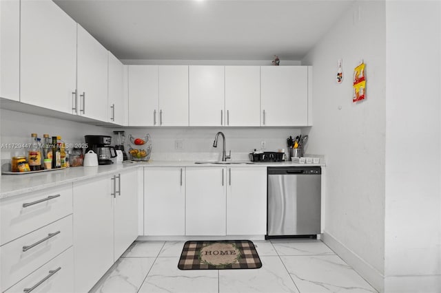 kitchen with sink, white cabinetry, and stainless steel dishwasher