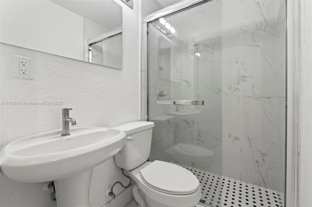 bathroom featuring sink, toilet, and walk in shower