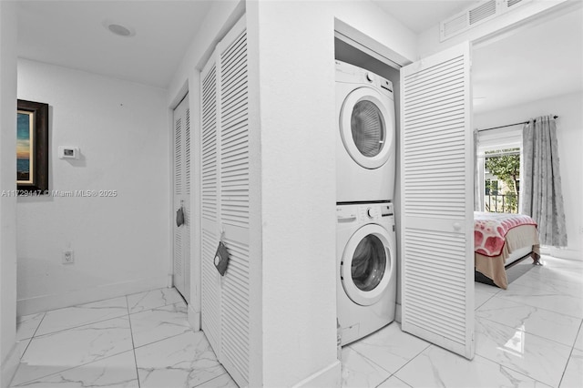 washroom with stacked washer / dryer