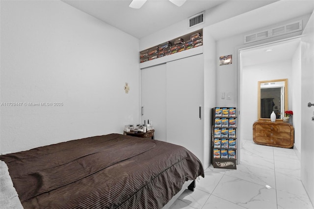 bedroom featuring ceiling fan and a closet