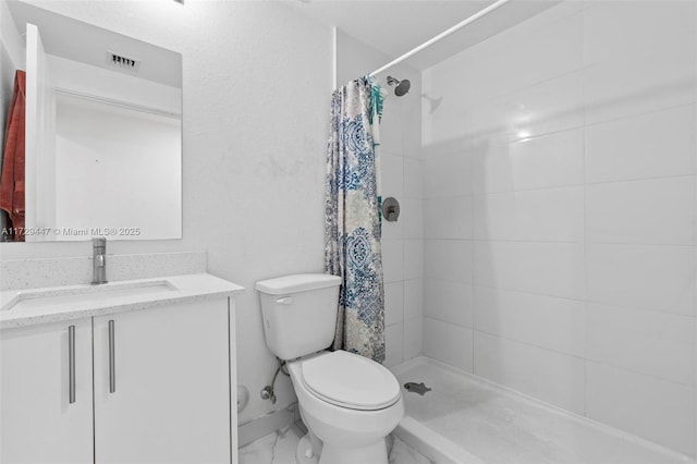 bathroom featuring vanity, toilet, and a shower with shower curtain