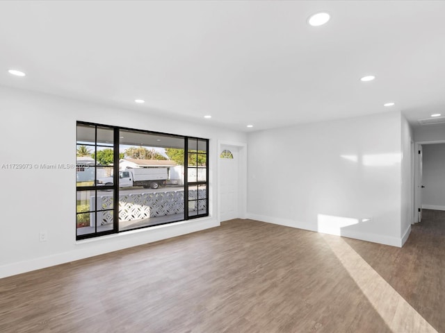 spare room featuring hardwood / wood-style flooring