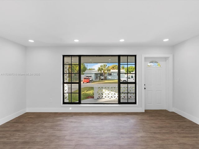 empty room with hardwood / wood-style flooring